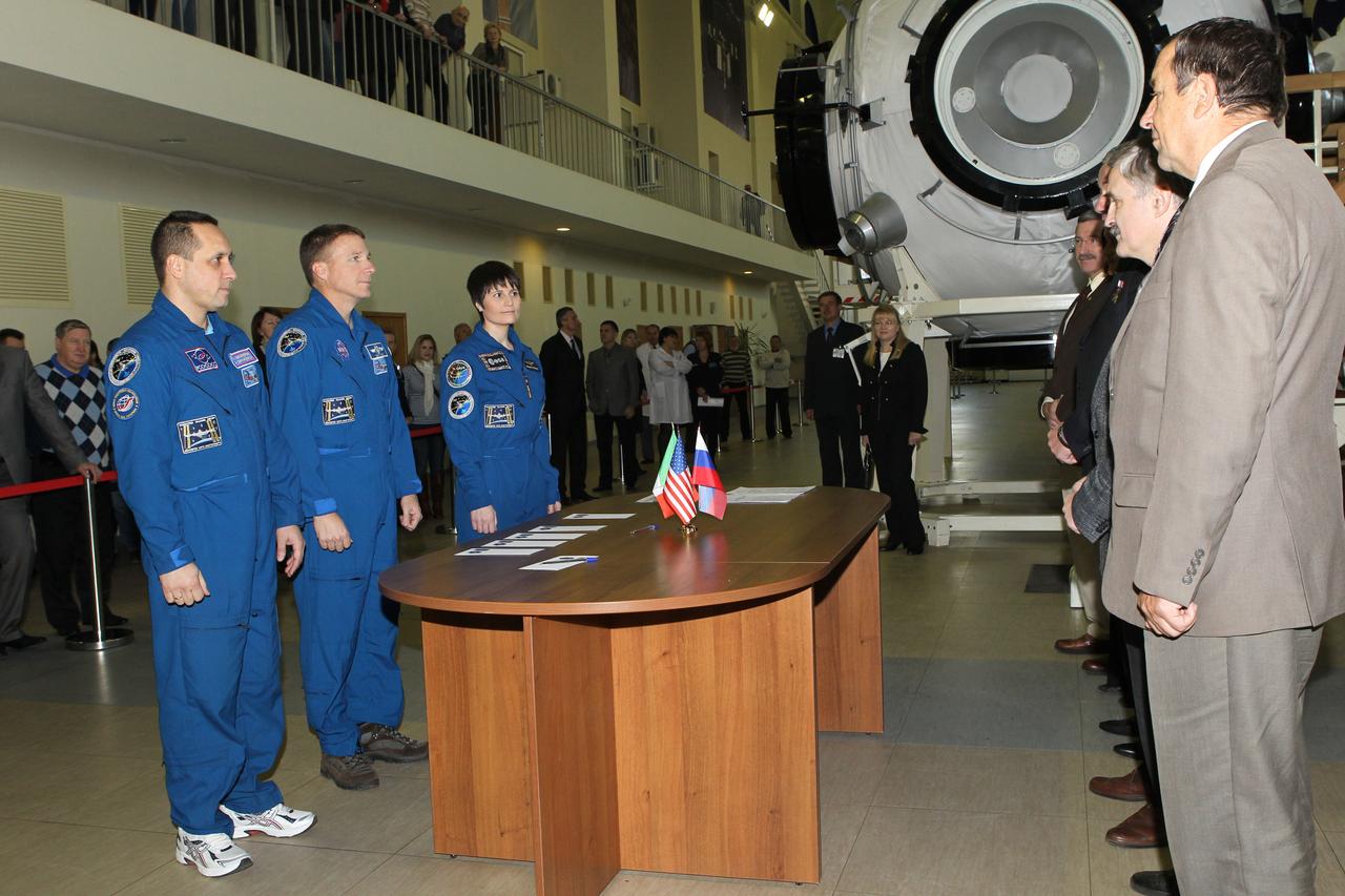 #3333 - (30 October 2014) --- At the Gagarin Cosmonaut Training Center in Star City, Russia, Expedition 42/43 Soyuz Commander Anton Shkaplerov of Roscosmos (left), Flight Engineer Terry Virts of NASA (center) and Flight Engineer Samantha Cristoforetti of the European Space Agency (right) listen to instructions from Russian space officials at the start of their qualification exams October 30. The trio is preparing for launch to the International Space Station from the Baikonur Cosmodrome in Kazakhstan on November 24, Kazakh time, in the Soyuz TMA-15M spacecraft to begin a five and a half month mission on the International Space Station. Photo credit: NASA/Stephanie Stoll 