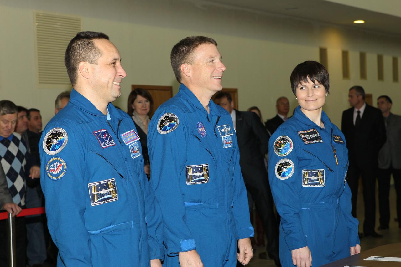 #3340 - (30 October 2014) --- At the Gagarin Cosmonaut Training Center in Star City, Russia, Expedition 42/43 Soyuz Commander Anton Shkaplerov of Roscosmos (left), Flight Engineer Terry Virts of NASA (center) and Flight Engineer Samantha Cristoforetti of the European Space Agency (right) share a light moment at the start of their qualification exams October 30. The trio is preparing for launch to the International Space Station from the Baikonur Cosmodrome in Kazakhstan on November 24, Kazakh time, in the Soyuz TMA-15M spacecraft to begin a five and a half month mission on the International Space Station. Photo credit: NASA/Stephanie Stoll 