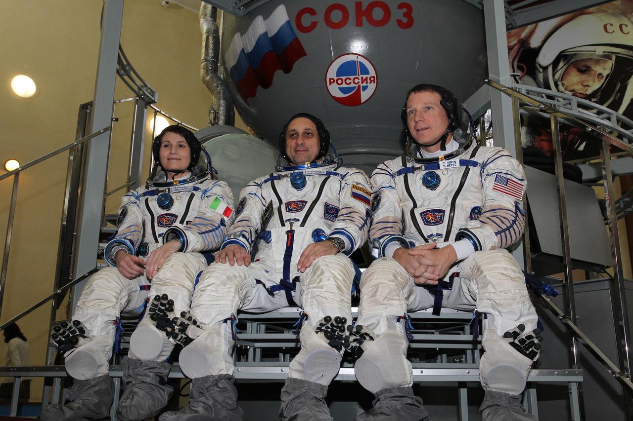 3546:  At the Gagarin Cosmonaut Training Center in Star City, Russia, Expedition 42/43 Flight Engineer Samantha Cristoforetti of the European Space Agency (left), Soyuz Commander Anton Shkaplerov of the Russian Federal Space Agency (Roscosmos) and NASA Flight Engineer Terry Virts pose for pictures during the second day of qualification exams October 31. The trio is preparing for launch in the Soyuz TMA-15M spacecraft from the Baikonur Cosmodrome in Kazakhstan Nov. 24, Kazakh time, for a 5 ½ month mission on the International Space Station.  NASA/Stephanie Stoll 