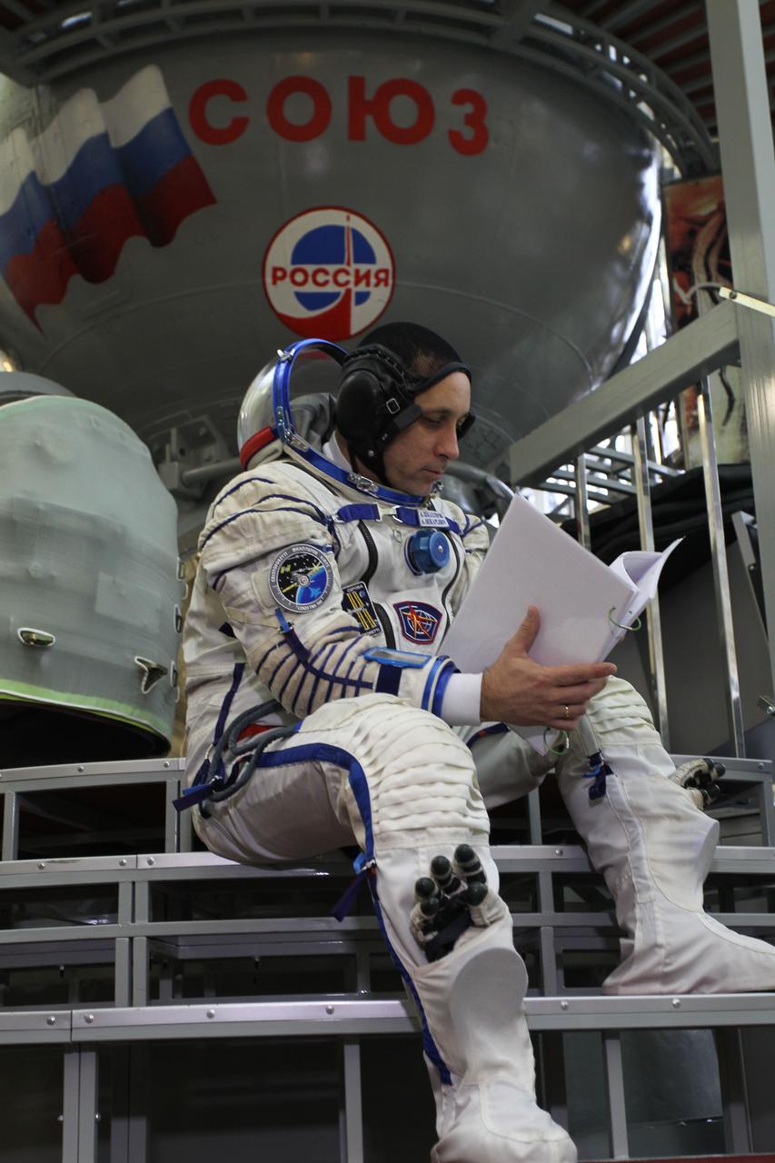 3593:  At the Gagarin Cosmonaut Training Center in Star City, Russia, Expedition 42/43 Soyuz Commander Anton Shkaplerov of the Russian Federal Space Agency (Roscosmos) studies systems manuals as he prepares to enter a Soyuz simulator October 31 for the second day of qualification exams. Shkaplerov, NASA Flight Engineer Terry Virts and European Space Agency Flight Engineer Samantha Cristoforetti are preparing for launch in the Soyuz TMA-15M spacecraft from the Baikonur Cosmodrome in Kazakhstan Nov. 24, Kazakh time, for a 5 ½ month mission on the International Space Station.  NASA/Stephanie Stoll 