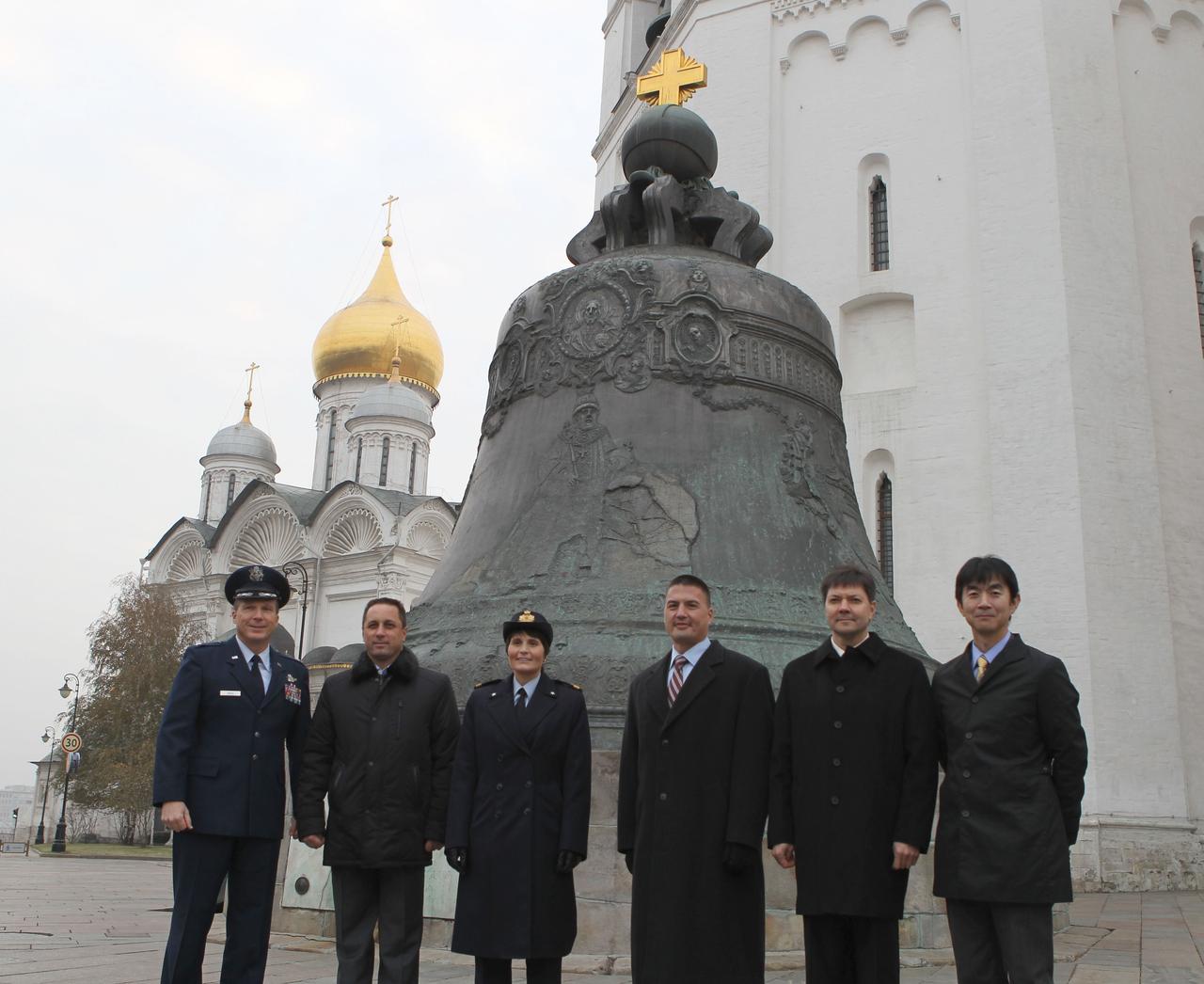 4198a:  At the Kremlin in Moscow, the Expedition 42/43 prime and backup crewmembers pose for pictures Nov. 6 in front of the famed Tsar Bell. From left to right are prime crewmembers Terry Virts of NASA, Anton Shkaplerov of the Russian Federal Space Agency (Roscosmos) and Samantha Cristoforetti of the European Space Agency and backup crewmembers Kjell Lindgren of NASA, Oleg Kononenko of Roscosmos and Kimiya Yui of the Japan Aerospace Exploration Agency. Virts, Shkaplerov and Cristoforetti will launch Nov. 24, Kazakh time from the Baikonur Cosmodrome in Kazakhstan on their Soyuz TMA-15M spacecraft for a 5 ½ month mission on the International Space Station.  NASA/Stephanie Stoll 