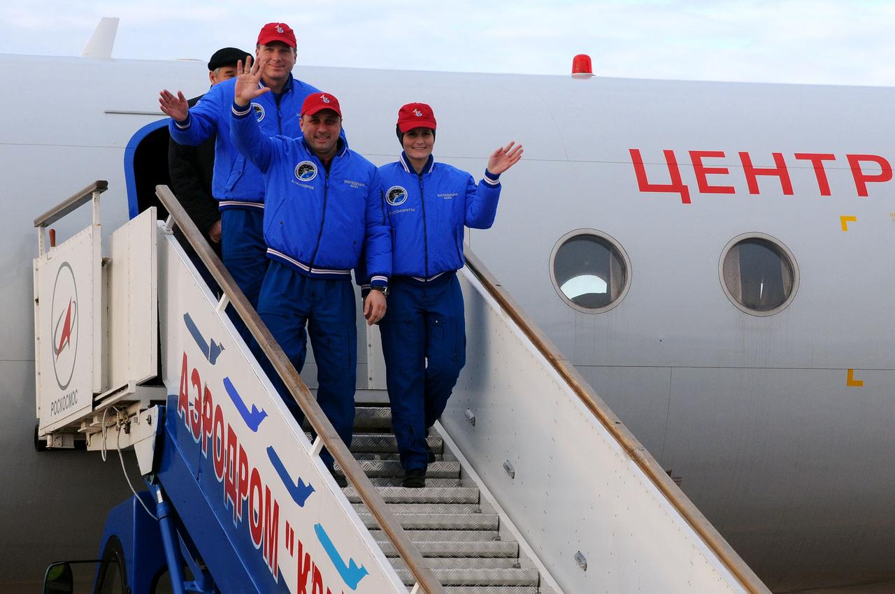 5158 OK:  At the Baikonur Cosmodrome in Kazakhstan, Expedition 42/43 crewmembers Terry Virts of NASA (top), Anton Shkaplerov of the Russian Federal Space Agency (Roscosmos, center) and Samantha Cristoforetti of the European Space Agency (right) disembark from a Gagarin Cosmonaut Training Center aircraft Nov. 11 after a flight from Star City, Russia to begin the final weeks of training for their launch to the International Space Station. The trio are preparing for their liftoff on the Soyuz TMA-15M spacecraft from Baikonur on Nov. 24, Kazakh time, for a five and a half month mission on the international outpost.  NASA/Victor Ivanov 