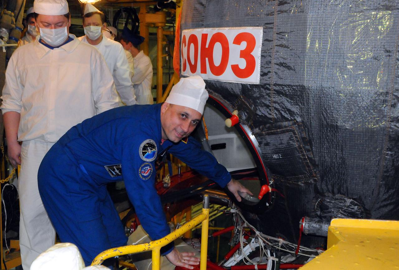 5295:  In the Integration Facility at the Baikonur Cosmodrome in Kazakhstan, Expedition 42/43 crewmember Anton Shkaplerov of the Russian Federal Space Agency (Roscosmos) climbs into the Soyuz TMA-15M spacecraft during a “fit check” dress rehearsal Nov. 12. Shkaplerov, Samantha Cristoforetti of the European Space Agency and Terry Virts of NASA will launch Nov. 24, Kazakh time, from Baikonur for a 5 ½ month mission on the International Space Station.  NASA/Victor Ivanov 