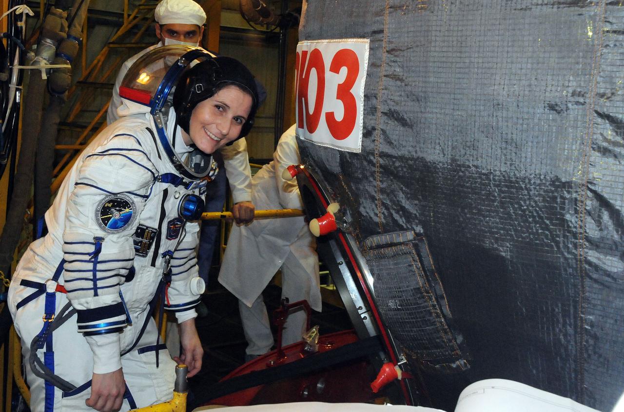 5542:  In the Integration Facility at the Baikonur Cosmodrome in Kazakhstan, Expedition 42/43 crewmember Samantha Cristoforetti of the European Space Agency climbs into the Soyuz TMA-15M spacecraft during a “fit check” dress rehearsal Nov. 12. Cristoforetti, Terry Virts of NASA and Anton Shkaplerov of the Russian Federal Space Agency (Roscosmos) will launch Nov. 24, Kazakh time, from Baikonur for a 5 ½ month mission on the International Space Station.  NASA/Victor Ivanov 
