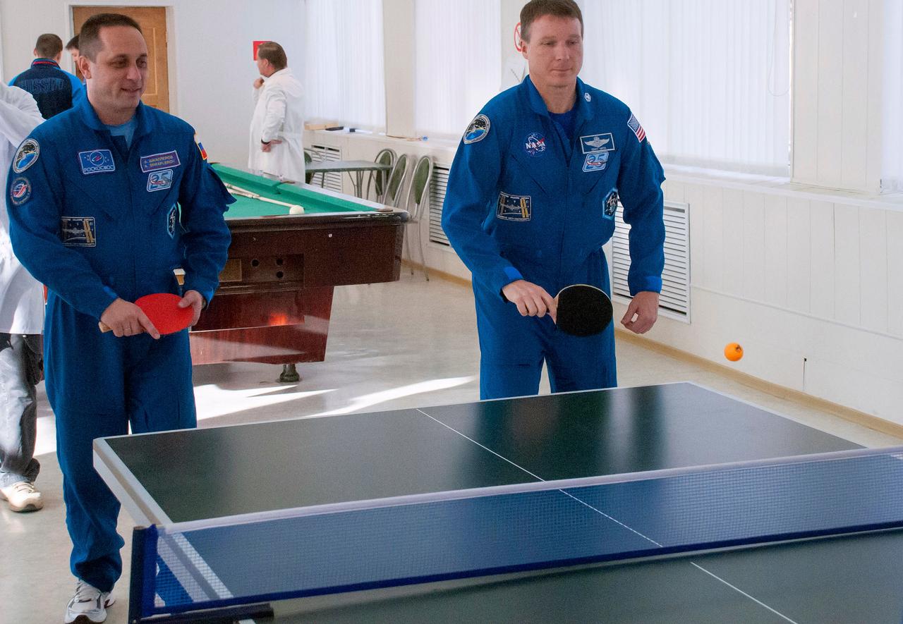 6005:  At the Cosmonaut Hotel crew quarters in Baikonur, Kazakhstan, Expedition 42/43 crewmember Terry Virts of NASA (right) tries his hand at Ping-Pong Nov. 18 as his Soyuz Commander, Anton Shkaplerov of the Russian Federal Space Agency (Roscosmos, left) looks on. Virts, Shkaplerov and Samantha Cristoforetti of the European Space Agency are preparing to launch Nov. 24, Kazakh time, from the Baikonur Cosmodrome in their Soyuz TMA-15M spacecraft for a 5 ½ month mission on the International Space Station.  NASA/Sergei Fyodorov 