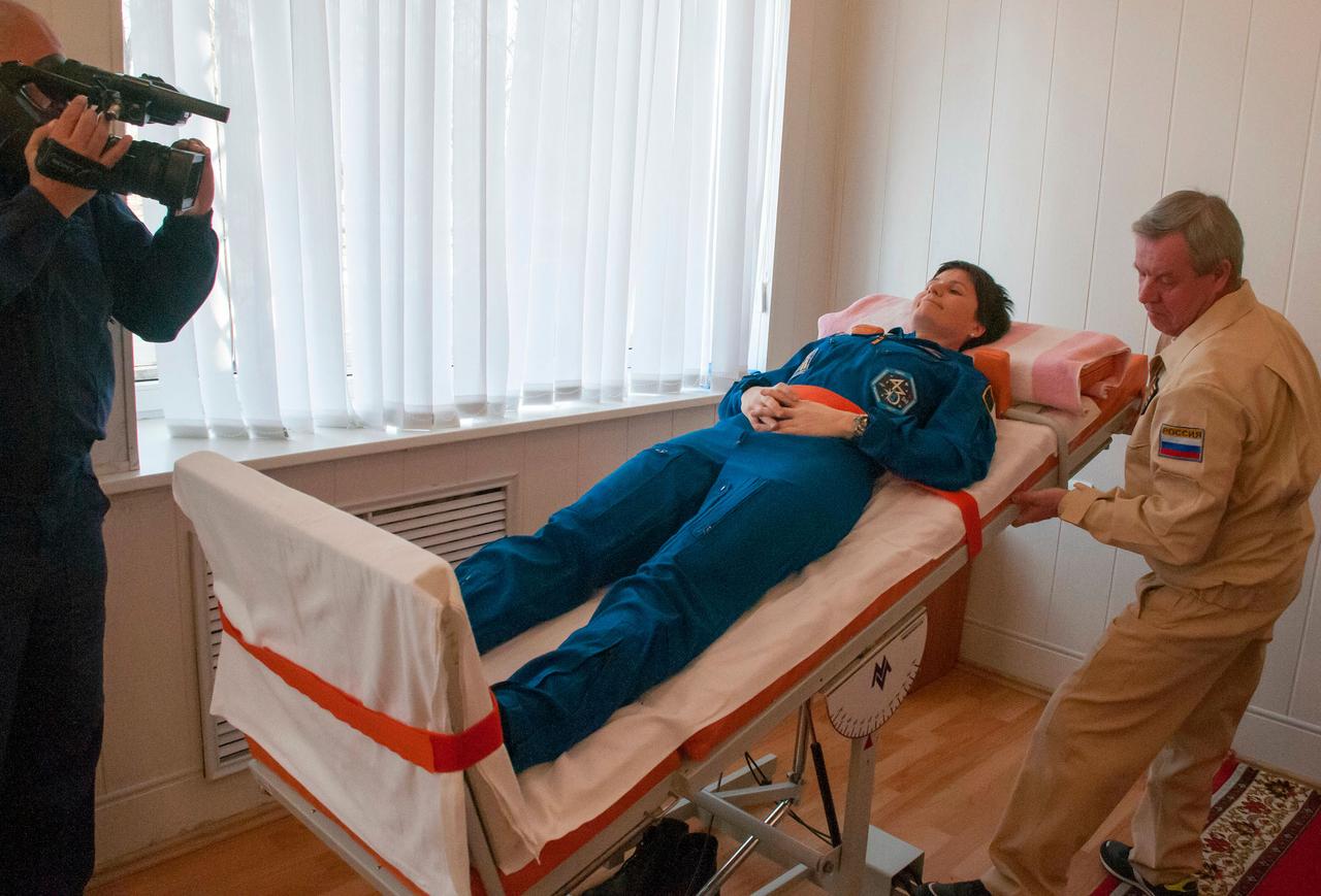 6103:  At the Cosmonaut Hotel crew quarters in Baikonur, Kazakhstan, Expedition 42/43 crewmember Samantha Cristoforetti of the European Space Agency tests her vestibular system on a tilt table Nov. 18 as part of pre-launch training. Cristoforetti, Terry Virts of NASA and Anton Shkaplerov of the Russian Federal Space Agency (Roscosmos) will launch Nov. 24, Kazakh time, from the Baikonur Cosmodrome in the Soyuz TMA-15M spacecraft for a 5 ½ month mission on the International Space Station.  NASA/Sergei Fyodorov 