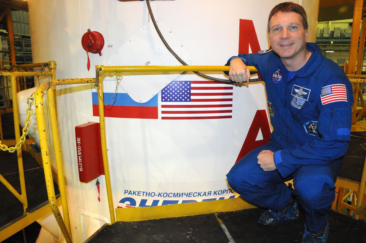 6401:  In the Integration Facility at the Baikonur Cosmodrome in Kazakhstan, Expedition 42/43 crewmember Terry Virts of NASA poses for a picture Nov. 19 by the Soyuz booster that will send the Soyuz TMA-15M spacecraft into orbit during the crew’s second and final pre-launch “fit check” dress rehearsal activities. Virts, Anton Shkaplerov of the Russian Federal Space Agency (Roscosmos) and Samantha Cristoforetti of the European Space Agency will launch on Nov. 24, Kazakh time, from Baikonur for a 5 ½ month mission on the International Space Station.  NASA/Viktor Ivanov 