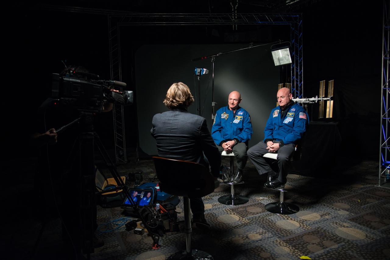 Expedition 45/46 Commander, Astronaut Scott Kelly along with his brother, former Astronaut Mark Kelly speak to news media outlets about Scott Kelly's 1-year mission aboard the International Space Station.  Photo Date: January 19, 2015.  Location: Building 2.  Photographer: Robert Markowitz