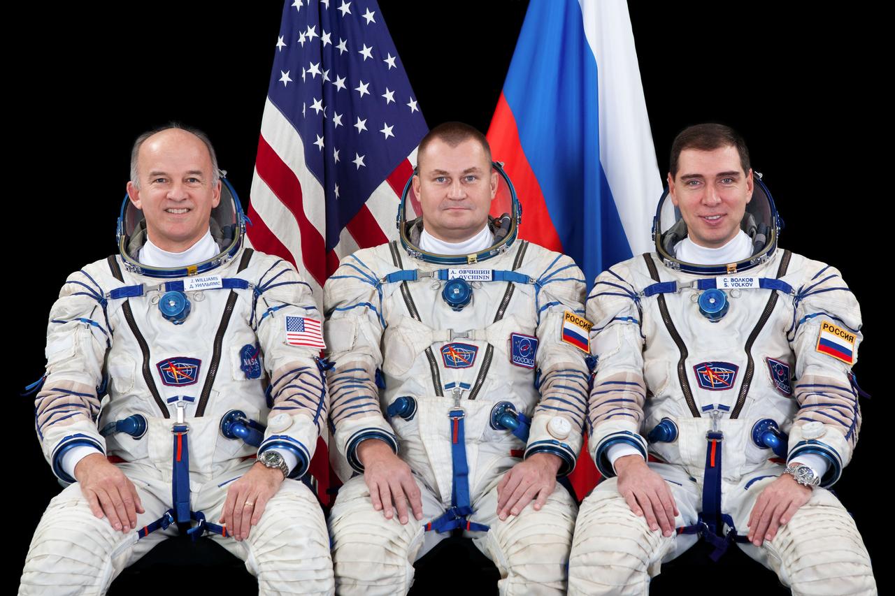 JSC2015E032661 (02/06/2015) --- The backup crew members for International Space Station Expedition 43 take a break in training with the prime crew for a crew portrait. From the left are Flight Engineers Jeff Williams of NASA, Alexey Ovchinin and Sergei Volkov of Russia's Federal Space Agency (Roscosmos.) Williams and Volkov are the backup One-Year Crew members. Credit: (Roscosmos/GCTC)