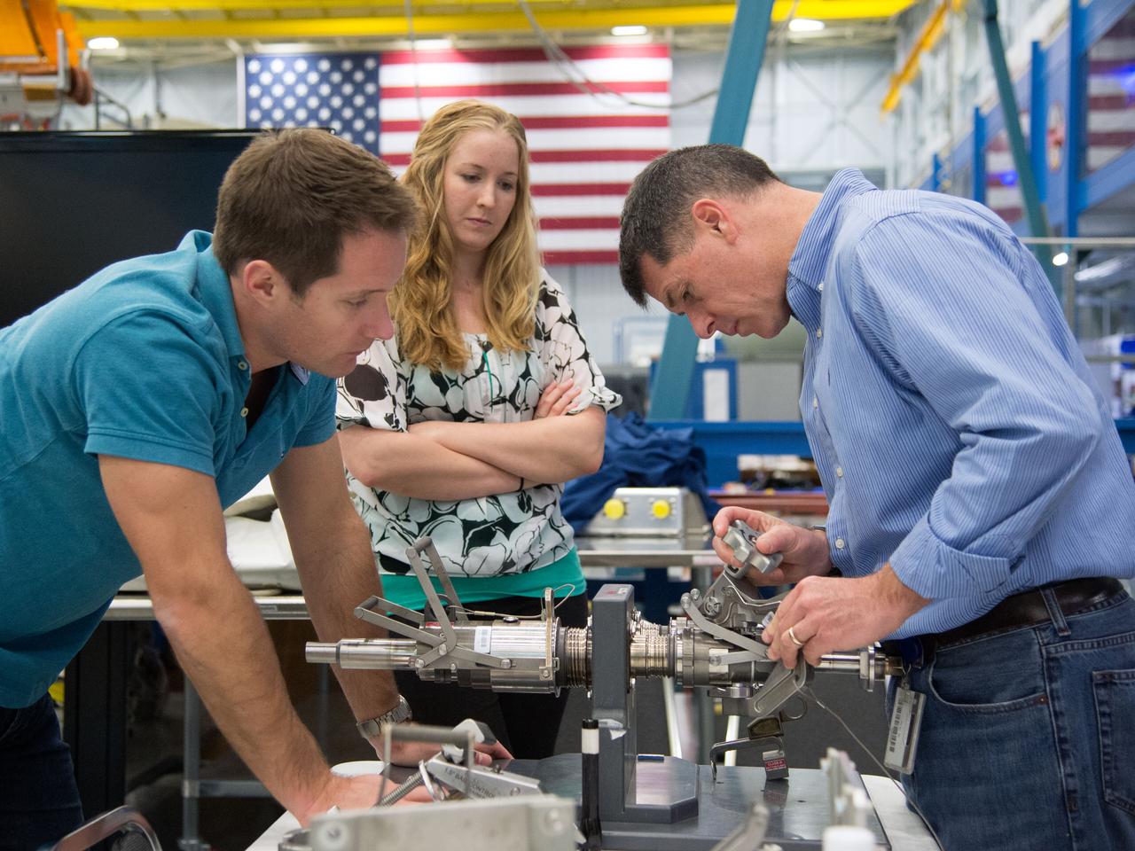 Date: 02-11-15 Loction: Bldg 9NW Subject:  Expedition 50 crew members Shane Kimbrough and Thomas Pesquet during ISS EVA Fluid QD Ops 1 with instructors Allissa Battocletti(purple) and Staphanie Johnston. Photographer: James Blair