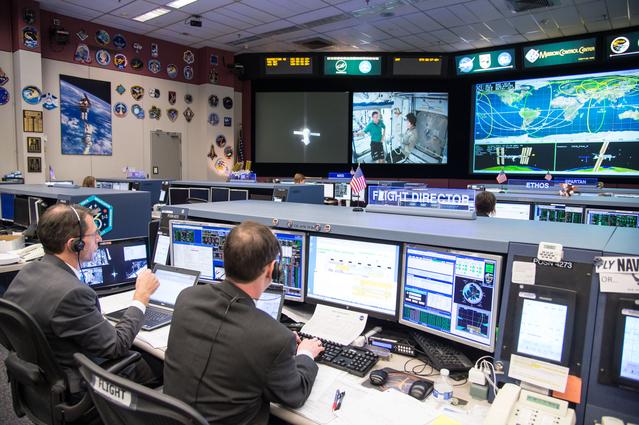 Date: 03-11-15.Location: Bldg 30, FCR-1.Subject:  Expedition 42 flight controllers on console in FCR-1 during the undocking of Expedition 42 crew (Samokutyaev, Wilmore, Serova) on the Soyuz TMA-14M spacecraft from the Poisk module on ISS.Photographer: James Blair