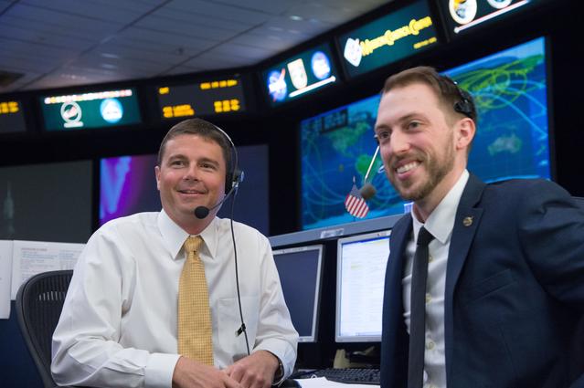 NASA image: DATE: 3-27-15.LOCATION:  Building 30 - ISS FCR-1.SUBJECT: Flight controllers during the launch of Scott Kelly and Cosmonaut Mikhail Kornienko for their historic one-year mission aboard the ISS. .PHOTOGRAPHER: Lauren Harnett