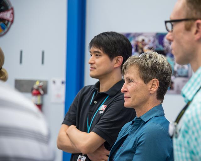 NASA image: PHOTO DATE:  04-23-15.LOCATION:   Bldg. 9NW - ISS Airlock Mockup .SUBJECT: Expedition 48/49 (Soyuz 47) crew members Kate Rubins and Takuya Onishi with Soyuz 49 crew member Peggy Whitson during ISS EVA P/P 1 training with instructor Grant Slusser.PHOTOGRAPHER:  BILL STAFFORD