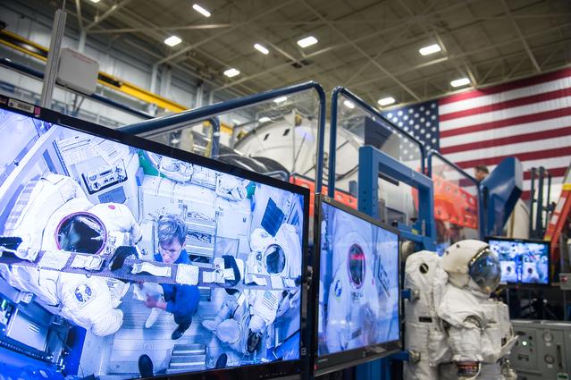 NASA image: PHOTO DATE:  04-23-15.LOCATION:   Bldg. 9NW - ISS Airlock Mockup .SUBJECT: Expedition 48/49 (Soyuz 47) crew members Kate Rubins and Takuya Onishi with Soyuz 49 crew member Peggy Whitson during ISS EVA P/P 1 training with instructor Grant Slusser.PHOTOGRAPHER:  BILL STAFFORD
