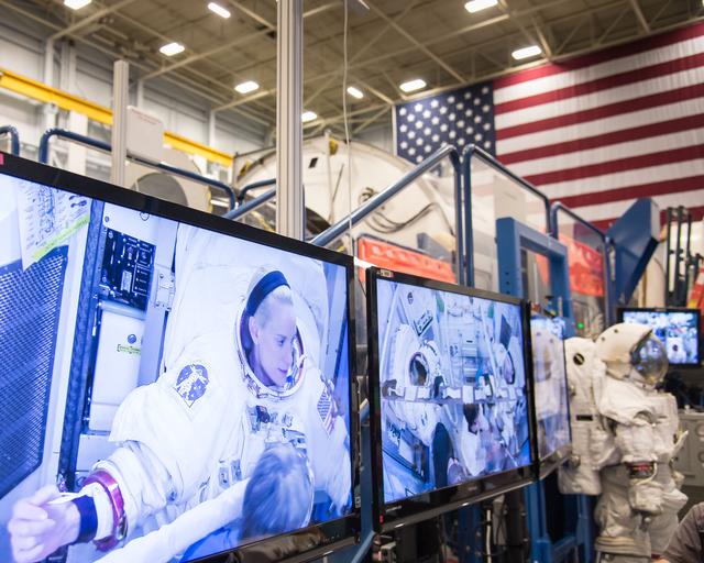 NASA image: PHOTO DATE:  04-23-15.LOCATION:   Bldg. 9NW - ISS Airlock Mockup .SUBJECT: Expedition 48/49 (Soyuz 47) crew members Kate Rubins and Takuya Onishi with Soyuz 49 crew member Peggy Whitson during ISS EVA P/P 1 training with instructor Grant Slusser.PHOTOGRAPHER:  BILL STAFFORD