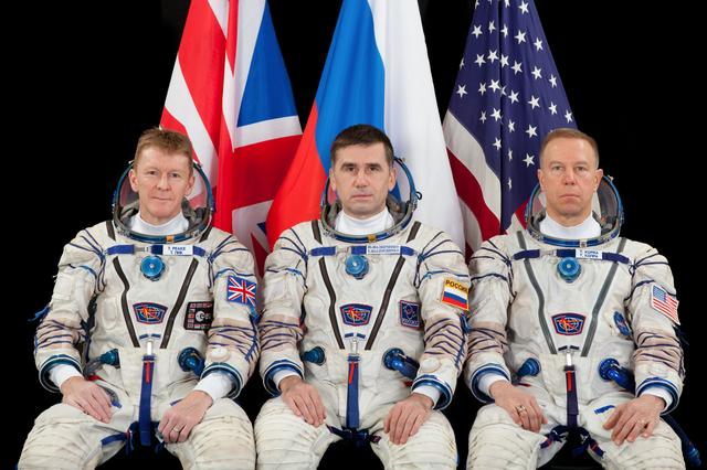 NASA image: Expedition 44 backup crew ESA (European Space Agency) astronaut Timothy Peake (left),  Russian cosmonaut Yuri Malenchenko (ROSCOSMOS) (center), and NASA astronaut Timothy L. Kopra