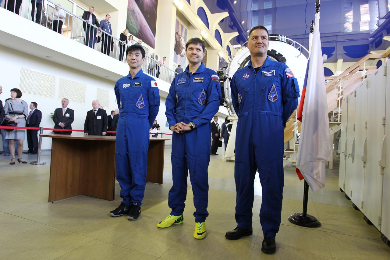 CG4G9036 --- (6 May 2015) --- At the Gagarin Cosmonaut Training Center in Star City, Russia, Expedition 44/45 crewmembers Kimya Yui of the Japan Aerospace Exploration Agency (left), Oleg Kononenko of the Russian Federal Space Agency (Roscosmos, center), and Kjell Lindgren of NASA (right) answer questions from media on the first of two days of qualification exams May 6. The trio is preparing for launch from the Baikonur Cosmodrome in Kazakhstan on May 27, Kazakh time, in the Soyuz TMA-17M spacecraft to begin a five and a half month mission to the International Space Station. Photo credit: NASA/Seth Marcantel