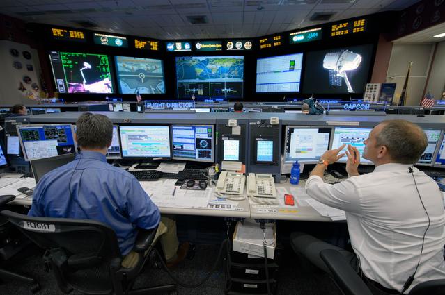 NASA image: Expedition 43 flight control team with Flight Director Gary Horlacher during the release of SpaceX Dragon cargo vehicle.  Photo Date: May 21, 2015.  Location: Building 30 - FCR1.  Photographer: Robert Markowitz