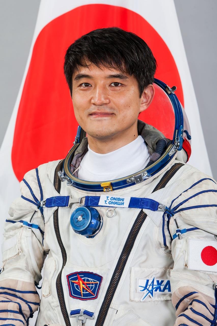 JSC2015e102006 (08/04/2015) --- Official suited portrait of  Expedition 48 Japan Aerospace Exploration Agency (JAXA) astronaut Takuya Onish wearing a Russian Sokol launch and entry suit.