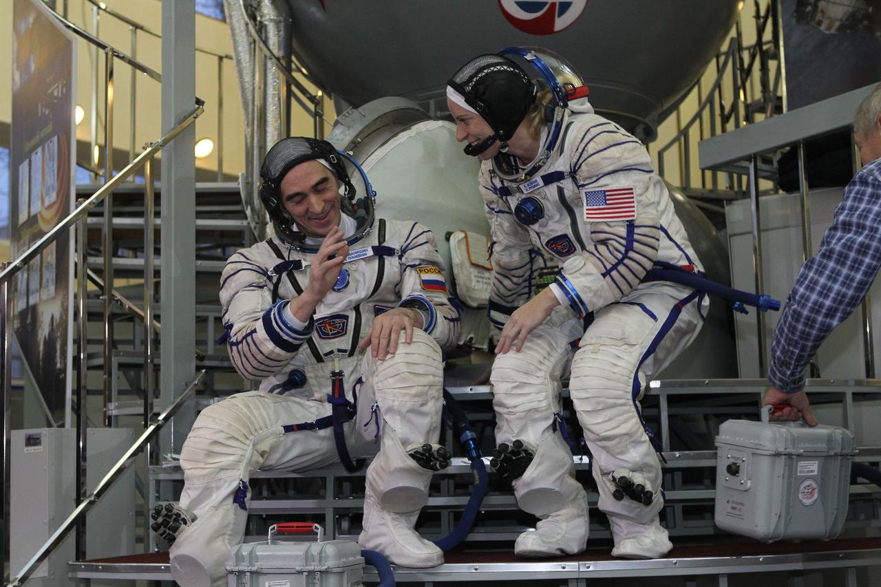 At the Gagarin Cosmonaut Training Center in Star City, Russia, Expedition 46-47 backup crewmembers Anatoly Ivanishin of the Russian Federal Space Agency (Roscosmos, left) and Kate Rubins of NASA prepare to enter a Soyuz simulator Nov. 19 at the start of qualification exams. Along with Takuya Onishi of the Japan Aerospace Exploration Agency, they are the backups to the prime crewmembers, Yuri Malenchenko of Roscosmos, Tim Kopra of NASA and Tim Peake of the European Space Agency, who will launch Dec. 15 in the Soyuz TMA-19M spacecraft from the Baikonur Cosmodrome in Kazakhstan for a six-month mission on the International Space Station. NASA/Seth Marcantel