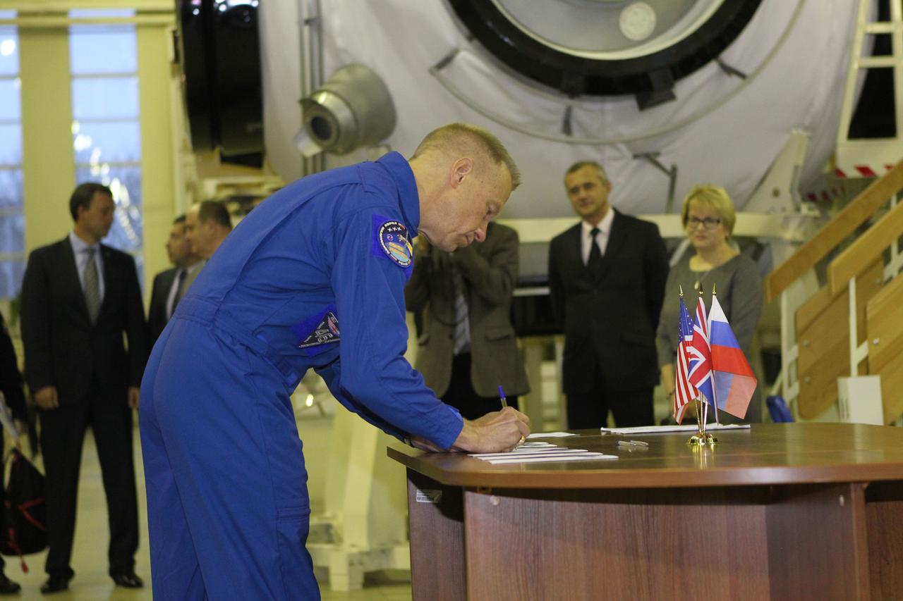 At the Gagarin Cosmonaut Training Center in Star City, Russia, Expedition 46-47 prime crewmember Tim Kopra of NASA signs in for the start of two days of qualification exams Nov. 19. Kopra, Yuri Malenchenko of the Russian Federal Space Agency (Roscosmos) and Tim Peake of the European Space Agency will launch Dec. 15 in the Soyuz TMA-19M spacecraft from the Baikonur Cosmodrome in Kazakhstan for a six-month mission on the International Space Station. NASA/Seth Marcantel