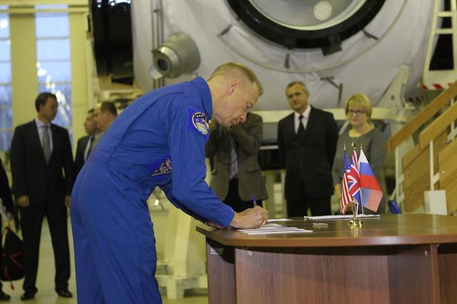 At the Gagarin Cosmonaut Training Center in Star City, Russia, Expedition 46-47 prime crewmember Tim Kopra of NASA signs in for the start of two days of qualification exams Nov. 19. Kopra, Yuri Malenchenko of the Russian Federal Space Agency (Roscosmos) and Tim Peake of the European Space Agency will launch Dec. 15 in the Soyuz TMA-19M spacecraft from the Baikonur Cosmodrome in Kazakhstan for a six-month mission on the International Space Station..NASA/Seth Marcantel