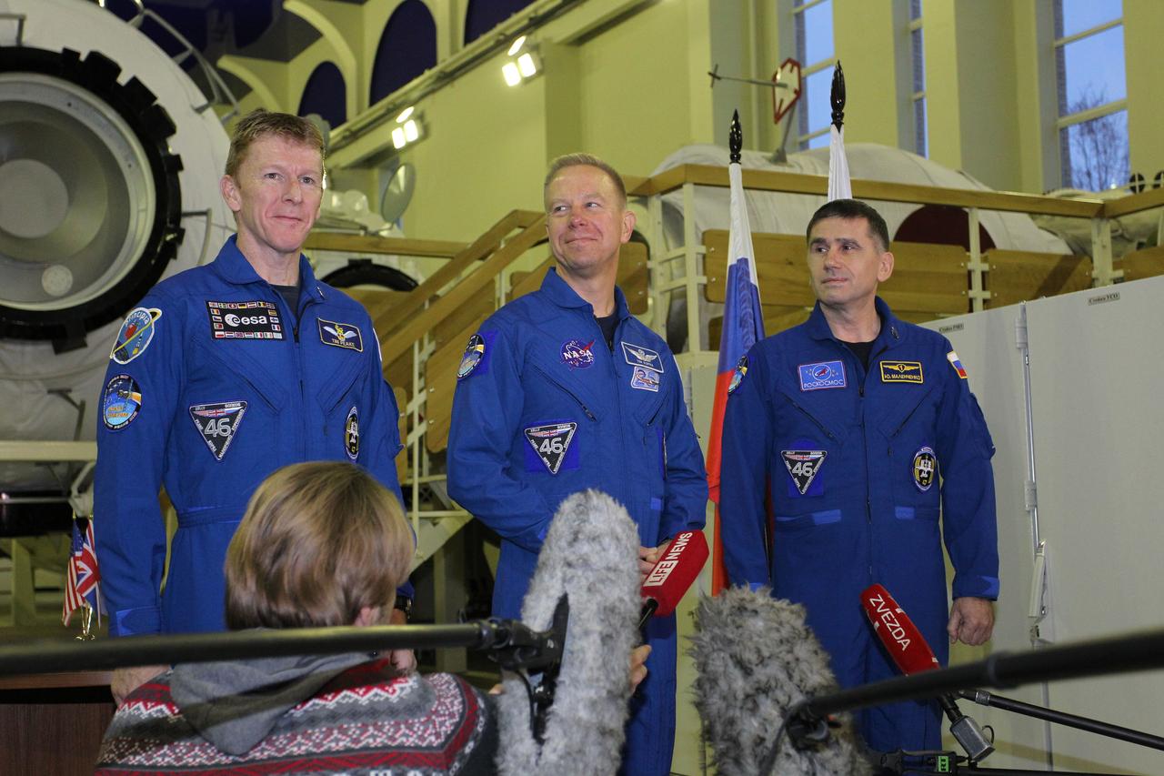 At the Gagarin Cosmonaut Training Center in Star City, Russia, Expedition 46-47 prime crewmembers Tim Peake of the European Space Agency (left), Tim Kopra of NASA (center) and Yuri Malenchenko of the Russian Federal Space Agency (Roscosmos, right) answer reporters’ questions Nov. 19 at the start of two days of qualification exams. They will launch Dec. 15 in the Soyuz TMA-19M spacecraft from the Baikonur Cosmodrome in Kazakhstan for a six-month mission on the International Space Station. NASA/Seth Marcantel