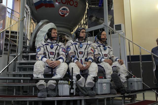 NASA image: At the Gagarin Cosmonaut Training Center in Star City, Russia, Expedition 46-47 crewmembers Tim Peake of the European Space Agency (left), Yuri Malenchenko of the Russian Federal Space Agency (Roscosmos, center) and Tim Kopra of NASA (right) listen to reporters��� questions at the start of their final qualification exam Nov. 20. The trio will launch Dec. 15 on their Soyuz TMA-19M spacecraft Dec. 15 from the Baikonur Cosmodrome in Kazakhstan for a six-month mission on the International Space Station..NASA/Seth Marcantel