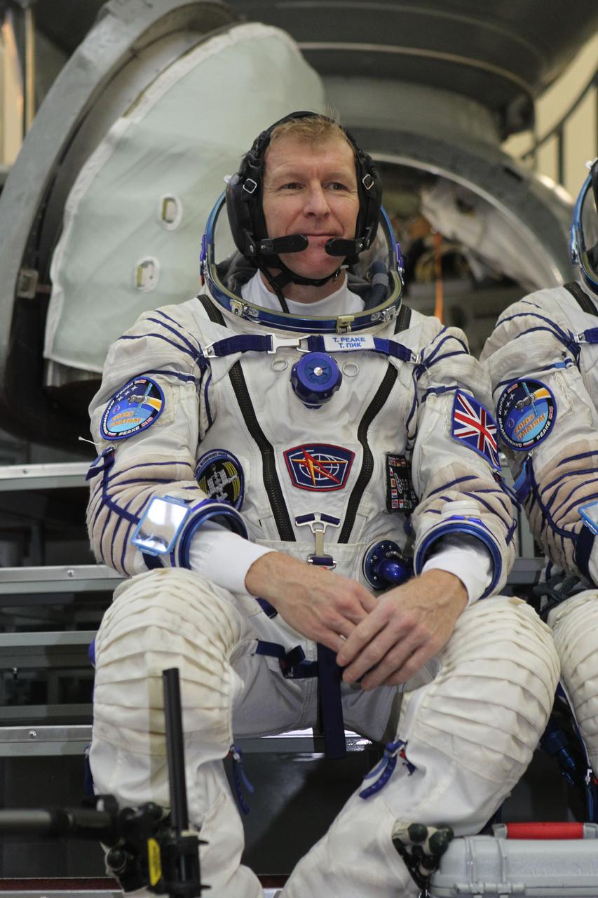 At the Gagarin Cosmonaut Training Center in Star City, Russia, Expedition 46-47 crewmember Tim Peake of the European Space Agency listens to a reporter’s question Nov. 20 during the start of final qualification exams. Peake, Yuri Malenchenko of the Russian Federal Space Agency (Roscosmos, center) and Tim Kopra of NASA (right) will launch Dec. 15 on their Soyuz TMA-19M spacecraft Dec. 15 from the Baikonur Cosmodrome in Kazakhstan for a six-month mission on the International Space Station. NASA/Seth Marcantel