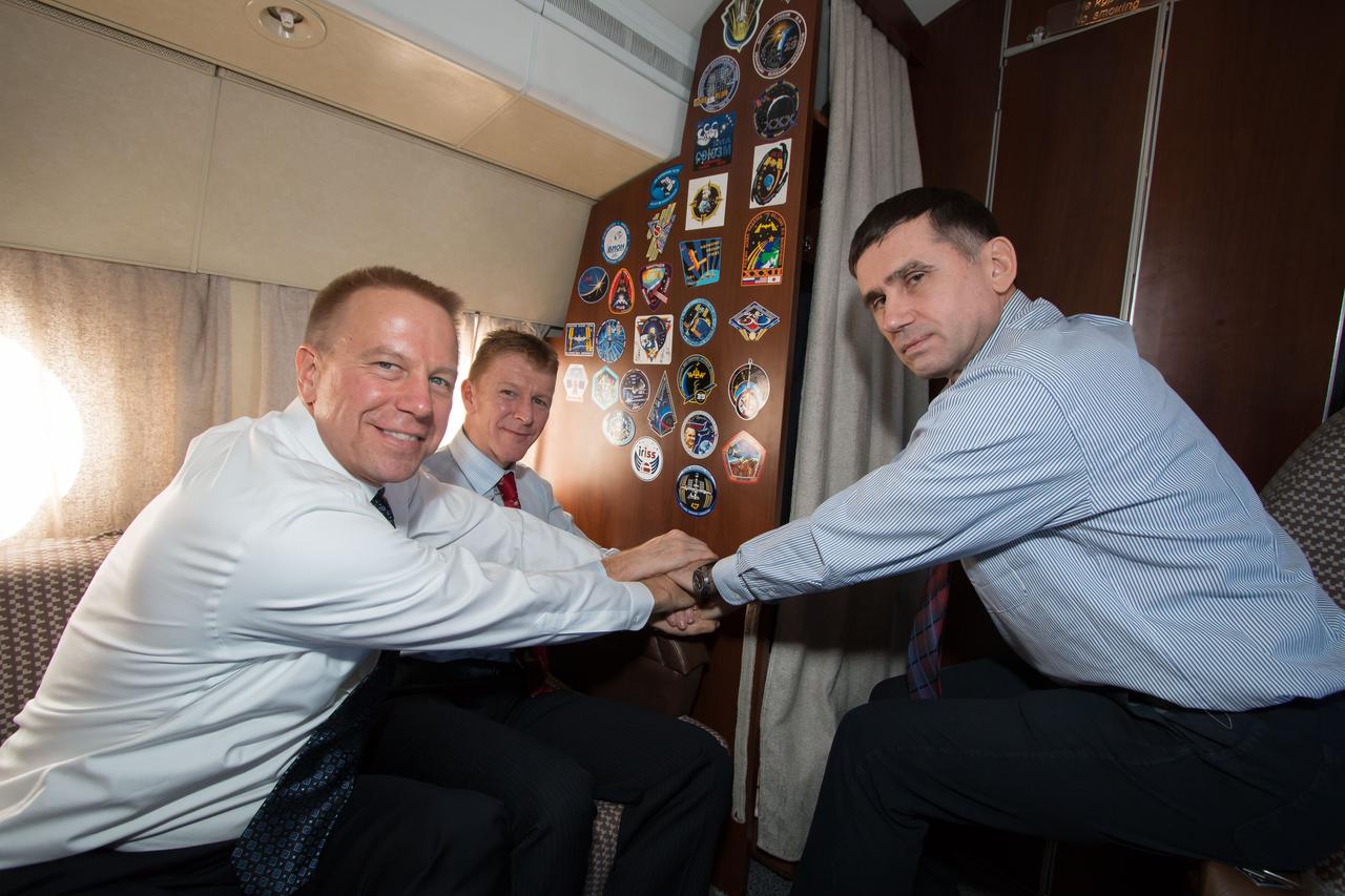 En route from the Gagarin Cosmonaut Training Center in Star City, Russia to their launch site at the Baikonur Cosmodrome in Kazakhstan, Expedition 46-47 crewmembers Tim Kopra of NASA (left), Tim Peake of the European Space Agency (center) and Yuri Malenchenko of the Russian Federal Space Agency (Roscosmos, right) pose for pictures Nov. 30 on their plane. Kopra, Peake and Malenchenko will launch Dec. 15 on the Soyuz TMA-19M spacecraft for a six-month mission on the International Space Station.  NASA / Victor Zelentsov                      