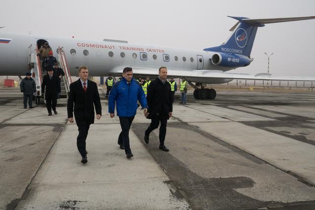 NASA image: The Expedition 46-47 crewmembers arrive in Baikonur, Kazakhstan Nov. 30 for final pre-launch training following a flight from their training base at the Gagarin Cosmonaut Training Center in Star City, Russia. Tim Peake of the European Space Agency (left), Yuri Malenchenko of the Russian Federal Space Agency (Roscosmos, center) and Tim Kopra of NASA (right) will launch Dec. 15 on the Soyuz TMA-19M spacecraft for a six-month mission on the International Space Station...NASA / Victor Zelentsov                  .