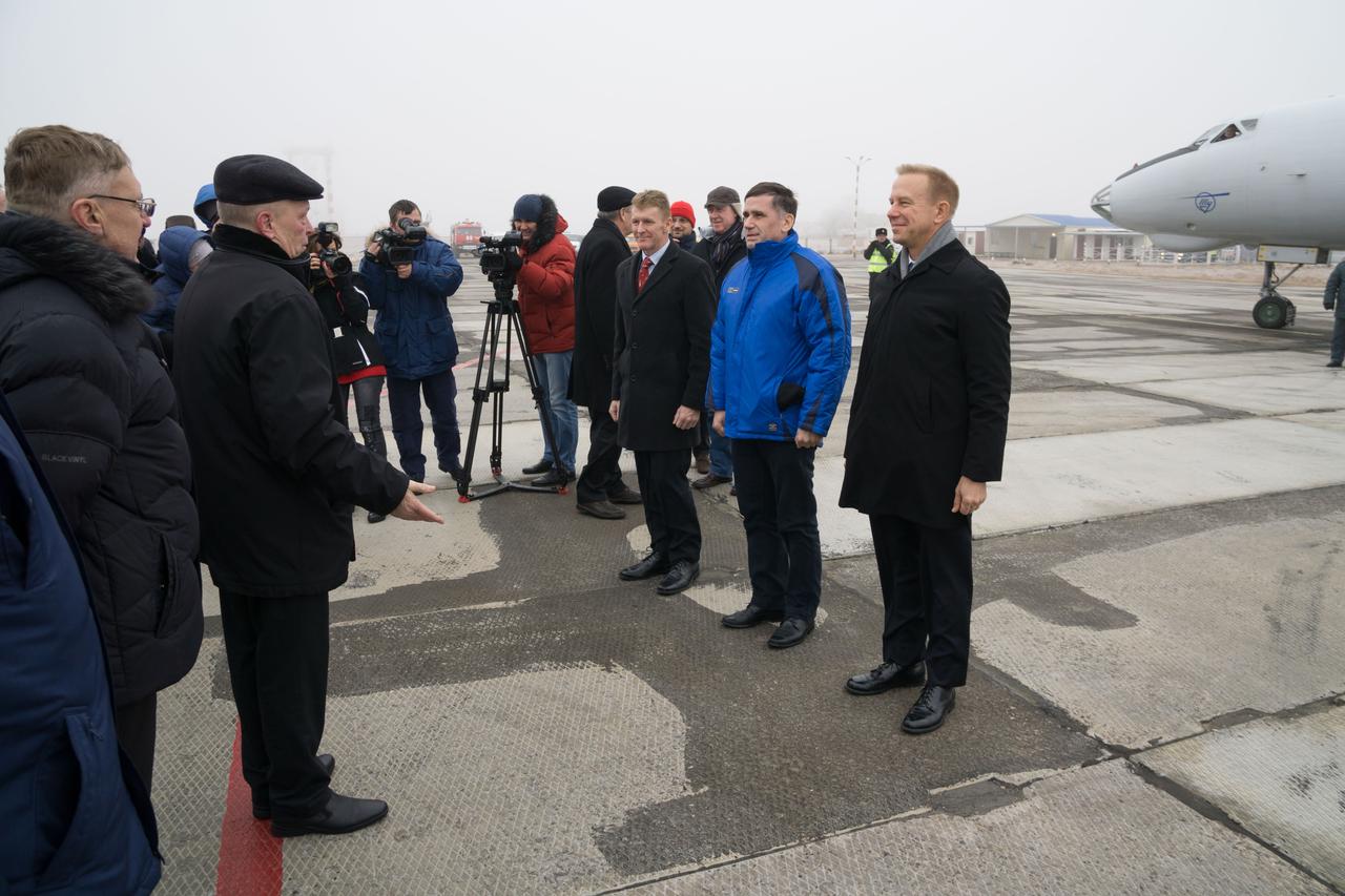 The Expedition 46-47 crewmembers arrive in Baikonur, Kazakhstan Nov. 30 for final pre-launch training following a flight from their training base at the Gagarin Cosmonaut Training Center in Star City, Russia. On the right of the frame are Tim Peake of the European Space Agency (left), Yuri Malenchenko of the Russian Federal Space Agency (Roscosmos, center) and Tim Kopra of NASA (right), who will launch Dec. 15 on the Soyuz TMA-19M spacecraft for a six-month mission on the International Space Station.  NASA / Victor Zelentsov 