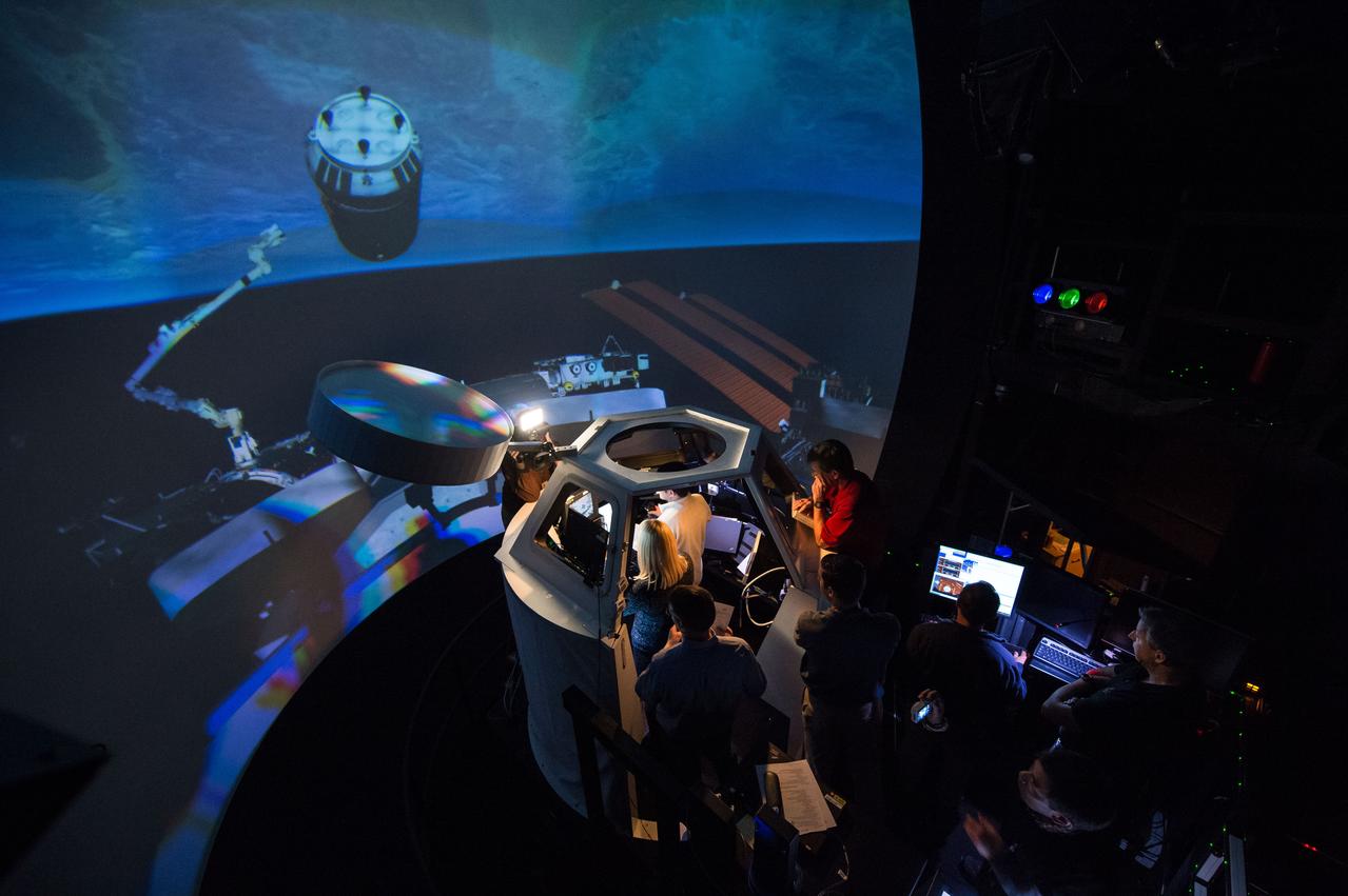 Date: 01-08-16 Location: Bldg 16N, SES Cupola Subject: Expedition 49 crew members Kate Rubins, Takuya Onishi and Shane Kimbrough during ROBO FS training. Photographer: James Blair