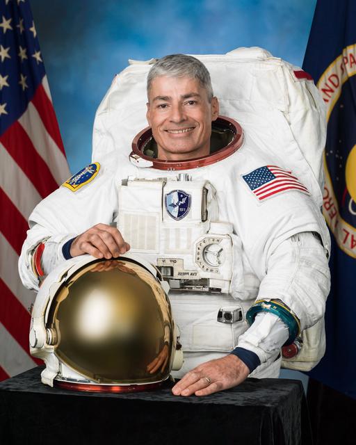 NASA image: PHOTO DATE: 01-06-16.LOCATION:  Bldg. 8, Room 183 - Photo Studio.SUBJECT: Official astronaut portrait of Expedition 51/52 crew member Mark Vande Hei in an EMU.PHOTOGRAPHER: BILL STAFFORD AND ROBERT MARKOWITZ