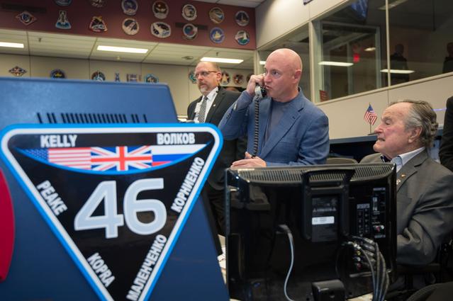 NASA image: Former President George H.W. Bush paid a visit to NASA's Johnson Space Center to speak with Expedition 46 Commander Scott Kelly and Flight Engineer Tim Kopra and take a tour of the Space Vehicle Mockup Facility.   Kelly���s twin brother, Mark Kelly and his wife, former Congresswoman Gabrielle Giffords were also present.  Photo Date: February 5, 2016.  Location: Building 30 - ISS Flight Control Room.  Photographer: Robert Markowitz