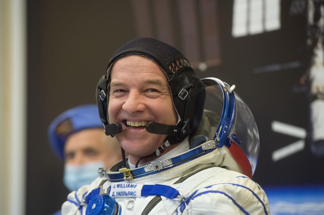 In the Integration Facility at the Baikonur Cosmodrome in Kazakhstan, Expedition 47-48 crewmember Jeff Williams of NASA flashes a smile as he suits up in his Russian Sokol launch and entry suit March 4 during final pre-launch training. Williams and Alexey Ovchinin and Oleg Skripochka of Roscosmos will launch March 19, Kazakh time, on the Soyuz TMA-20M spacecraft for a six-month mission on the International Space Station. Courtesy of Gagarin Cosmonaut Training Center