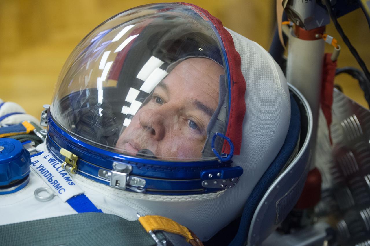 In the Integration Facility at the Baikonur Cosmodrome in Kazakhstan, Expedition 47-48 crewmember Jeff Williams of NASA strikes a thoughtful look in his Russian Sokol launch and entry suit March 4 during leak checks of the suit as part of pre-launch training. Williams and Alexey Ovchinin and Oleg Skripochka of Roscosmos will launch March 19, Kazakh time, on the Soyuz TMA-20M spacecraft for a six-month mission on the International Space Station. Courtesy of Gagarin Cosmonaut Training Center