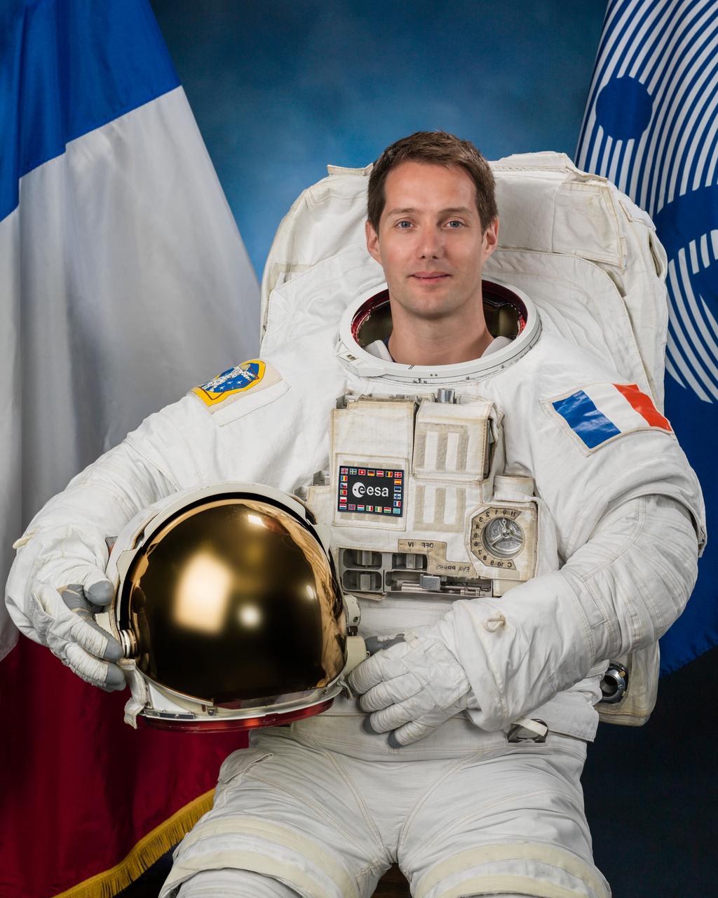 JSC2016e026853 (06/13/2016) --- Official portrait of Expedition 50 ESA (European Space Agency) astronaut Thomas Pesquet in a spacesuit (EMU) suit.  PHOTOGRAPHER: BILL STAFFORD