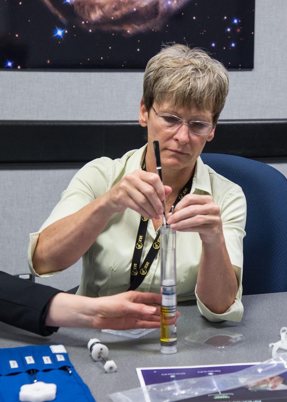 Photo Date: 03/30/16 Location: JSC B5, Room 3101 Subject:  Expedition 50/51 crew member Peggy Whitson during P APEX hardware and science objectives training with instructors Kathy Brown and Nancy Horvath. Photographer: Regan Geeseman