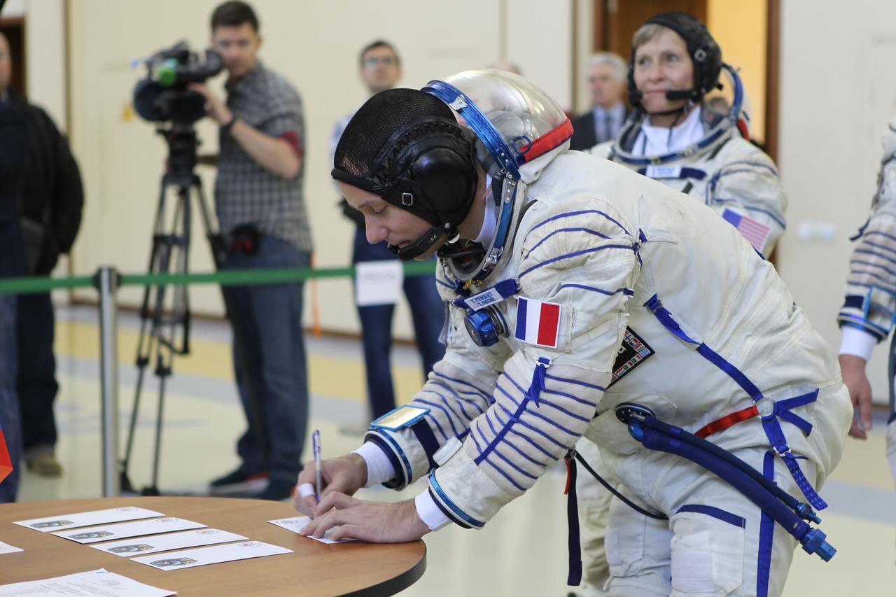 At the Gagarin Cosmonaut Training Center in Star City, Russia, Expedition 48-49 backup crewmember Thomas Pesquet of the European Space Agency signs in for Soyuz qualification exams May 26. Pesquet, Peggy Whitson of NASA and Oleg Novitskiy of Roscosmos are serving as the backups to prime crewmembers Kate Rubins of NASA, Takuya Onishi of the Japan Aerospace Exploration Agency and Anatoly Ivanishin of Roscosmos, who will launch June 24 on the Soyuz MS-01 spacecraft from the Baikonur Cosmodrome in Kazakhstan for a four-month mission on the International Space Station.  NASA/Stephanie Stoll 