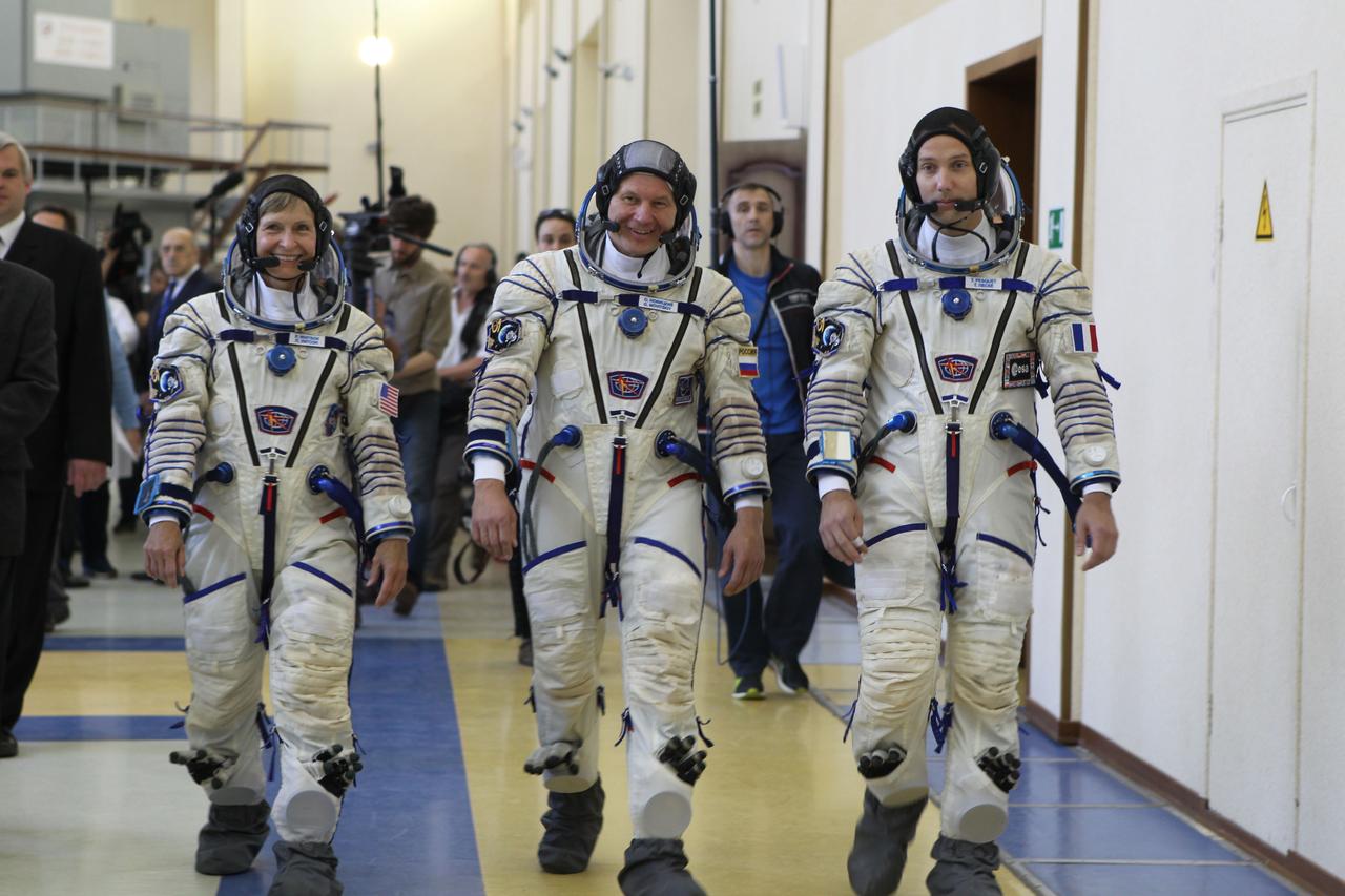 At the Gagarin Cosmonaut Training Center in Star City, Russia, Expedition 48-49 backup crewmembers Peggy Whitson of NASA (left), Oleg Novitskiy of Roscosmos (center) and Thomas Pesquet of the European Space Agency (right) arrive for Soyuz qualification exams May 26. They are serving as the backups to prime crewmembers Kate Rubins of NASA, Takuya Onishi of the Japan Aerospace Exploration Agency and Anatoly Ivanishin of Roscosmos, who will launch June 24 on the Soyuz MS-01 spacecraft from the Baikonur Cosmodrome in Kazakhstan for a four-month mission on the International Space Station.  NASA/Stephanie Stoll 