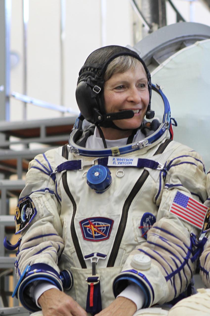 At the Gagarin Cosmonaut Training Center in Star City, Russia, Expedition 48-49 backup crewmember Peggy Whitson of NASA flashes a smile in front of a Soyuz simulator May 26 during final qualification exams. Whitson, Thomas Pesquet of the European Space Agency and Oleg Novitskiy of Roscosmos are serving as the backups to prime crewmembers Kate Rubins of NASA, Takuya Onishi of the Japan Aerospace Exploration Agency and Anatoly Ivanishin of Roscosmos, who will launch June 24 on the Soyuz MS-01 spacecraft from the Baikonur Cosmodrome in Kazakhstan for a four-month mission on the International Space Station.  NASA/Stephanie Stoll 