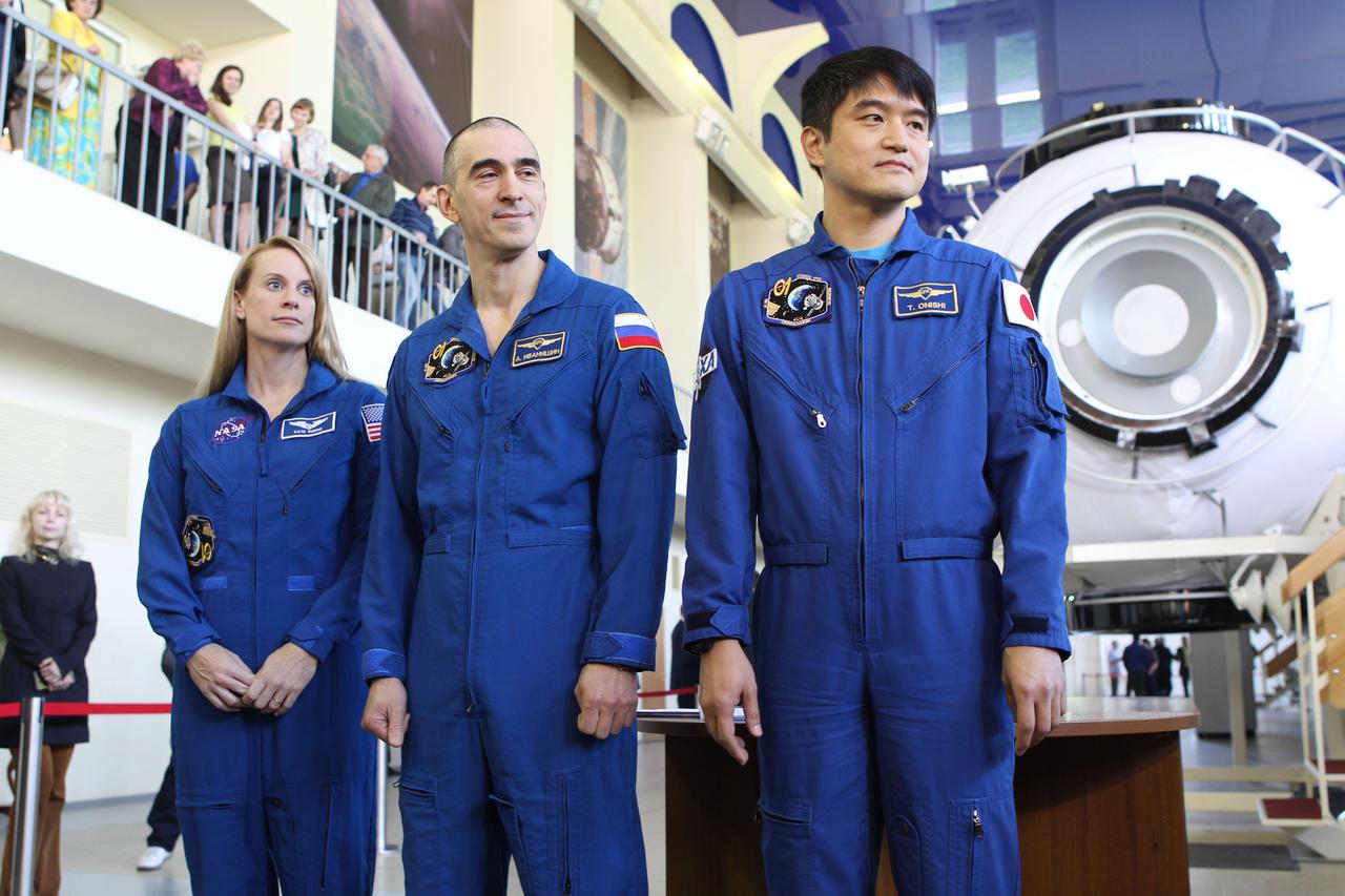 At the Gagarin Cosmonaut Training Center in Star City, Russia, Expedition 48-49 prime crewmembers Kate Rubins of NASA (left), Anatoly Ivanishin of Roscosmos (center) and Takuya Onishi of the Japan Aerospace Exploration Agency (right) pose for pictures May 26 during a final qualification exam session. Rubins, Onishi and Ivanishin will launch June 24 on the Soyuz MS-01 spacecraft from the Baikonur Cosmodrome in Kazakhstan for a four-month mission on the International Space Station.  NASA/Stephanie Stoll 