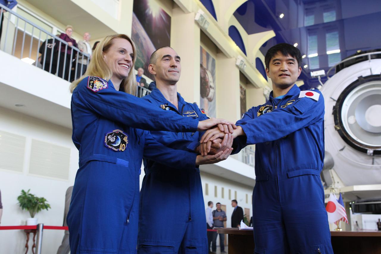 At the Gagarin Cosmonaut Training Center in Star City, Russia, Expedition 48-49 prime crewmembers Kate Rubins of NASA (left), Anatoly Ivanishin of Roscosmos (center) and Takuya Onishi of the Japan Aerospace Exploration Agency (right) pose for pictures May 26 during a final qualification exam session. Rubins, Onishi and Ivanishin will launch June 24 on the Soyuz MS-01 spacecraft from the Baikonur Cosmodrome in Kazakhstan for a four-month mission on the International Space Station.  NASA/Stephanie Stoll 
