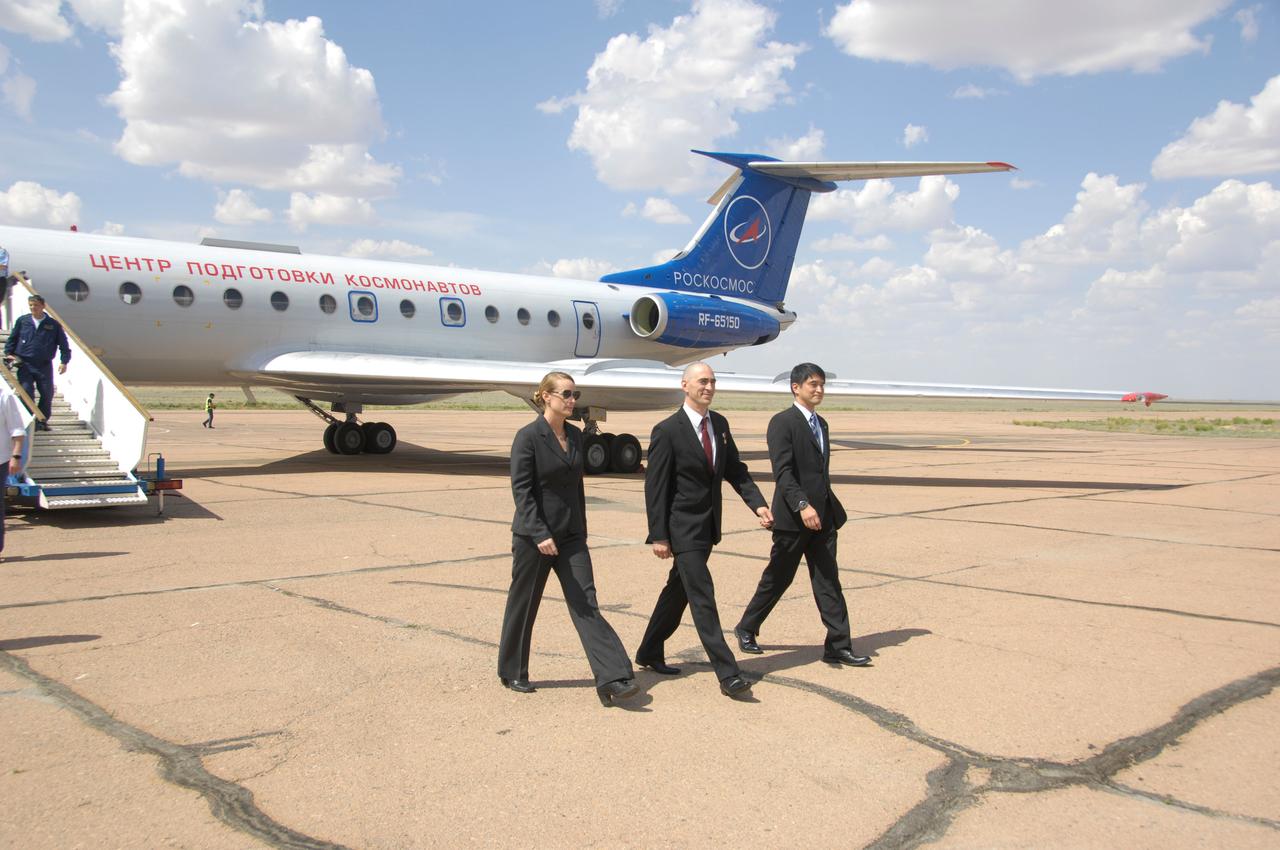ISS Expedition 48-49 prime crewmembers Kate Rubins of NASA (left), Anatoly Ivanishin of Roscosmos (center) and Takuya Onishi of the Japan Aerospace Exploration Agency (right) arrive in Baikonur, Kazakhstan June 24 for final pre-launch training after flying from Star City, Russia. The trio will launch July 7 from the Baikonur Cosmodrome in Kazakhstan on the Soyuz MS-01 spacecraft for a planned four-month mission on the International Space Station.  NASA/Alexander Vysotsky 