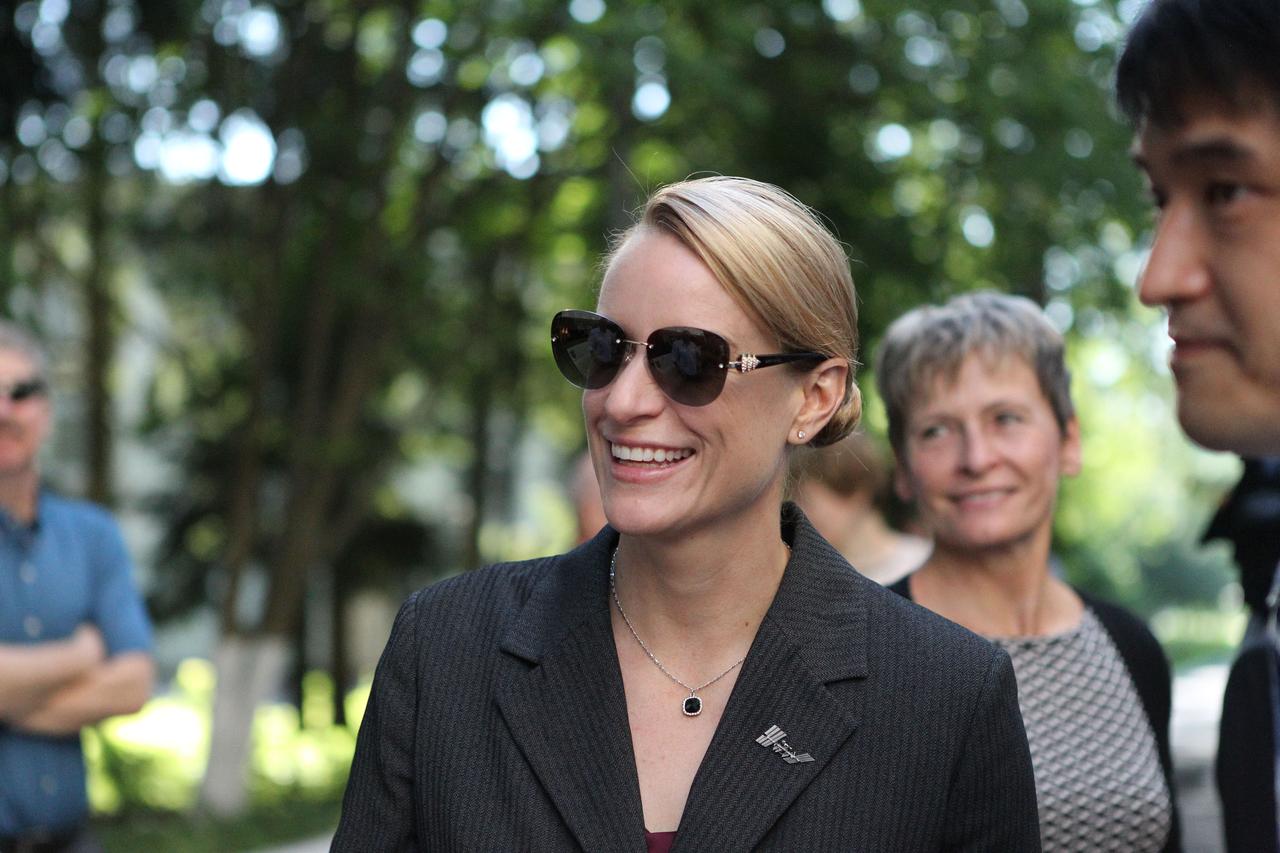ISS Expedition 48-49 crewmember Kate Rubins of NASA (left) flashes a smile June 24 at the Gagarin Cosmonaut Training Center in Star City, Russia before flying to her launch site at the Baikonur Cosmodrome in Kazakhstan for final pre-launch training. Looking on are crewmate Takuya Onishi of the Japan Aerospace Exploration Agency (right) and backup crewmember Peggy Whitson of NASA (background). Rubins, Anatoly Ivanishin of Roscosmos and Onishi will launch July 7 from the Baikonur Cosmodrome in Kazakhstan on the Soyuz MS-01 spacecraft for a planned four-month mission on the International Space Station.  NASA/Stephanie Stoll 