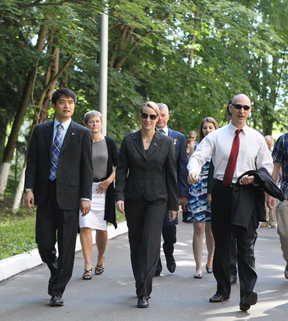 At the Gagarin Cosmonaut Training Center in Star City, Russia, ISS Expedition 48-49 prime crewmembers Takuya Onishi of the Japan Aerospace Exploration Agency (left), Kate Rubins of NASA (center) and Anatoly Ivanishin of Roscosmos (right) walk to their bus June 24 as they departed for their launch site at the Baikonur Cosmodrome in Kazakhstan. In the background on the left is backup crewmember Peggy Whitson of NASA and in the background center is backup crewmember Oleg Novitskiy of Roscosmos. Rubins, Ivanishin and Onishi will launch July 7 from the Baikonur Cosmodrome in Kazakhstan on the Soyuz MS-01 spacecraft for a planned four-month mission on the International Space Station...NASA/Stephanie Stoll.
