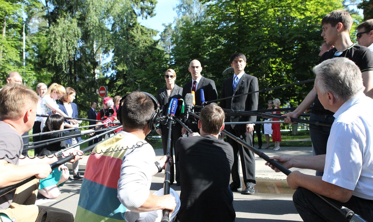 At the Gagarin Cosmonaut Training Center in Star City, Russia, ISS Expedition 48-49 crewmembers Kate Rubins of NASA (left), Anatoly Ivanishin of Roscosmos (center) and Takuya Onishi of the Japan Aerospace Exploration Agency (right) answer questions from reporters June 24 before departing for their launch site at the Baikonur Cosmodrome in Kazakhstan. The trio will launch July 7 from the Baikonur Cosmodrome in Kazakhstan on the Soyuz MS-01 spacecraft for a planned four-month mission on the International Space Station.  NASA/Stephanie Stoll 