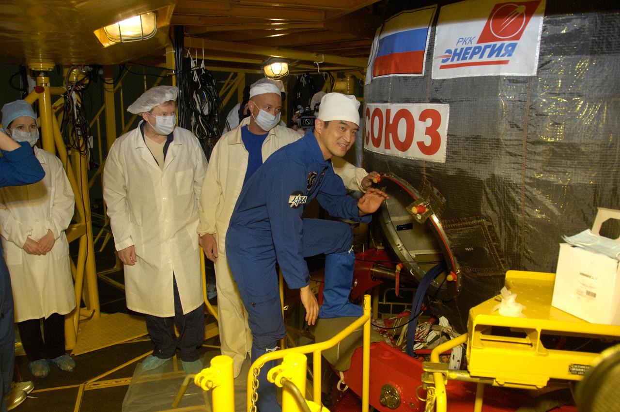 In the Integration Facility at the Baikonur Cosmodrome in Kazakhstan, Expedition 48-49 crewmember Takuya Onishi of the Japan Aerospace Exploration Agency climbs aboard the Soyuz MS-01 spacecraft June 25 for a “fit check” dress rehearsal activity. Onishi, Kate Rubins of NASA and Anatoly Ivanishin of Roscosmos will launch on July 7, Baikonur time, on the Soyuz MS-01 for a planned four-month mission on the International Space Station.  NASA/Alexander Vysotsky 