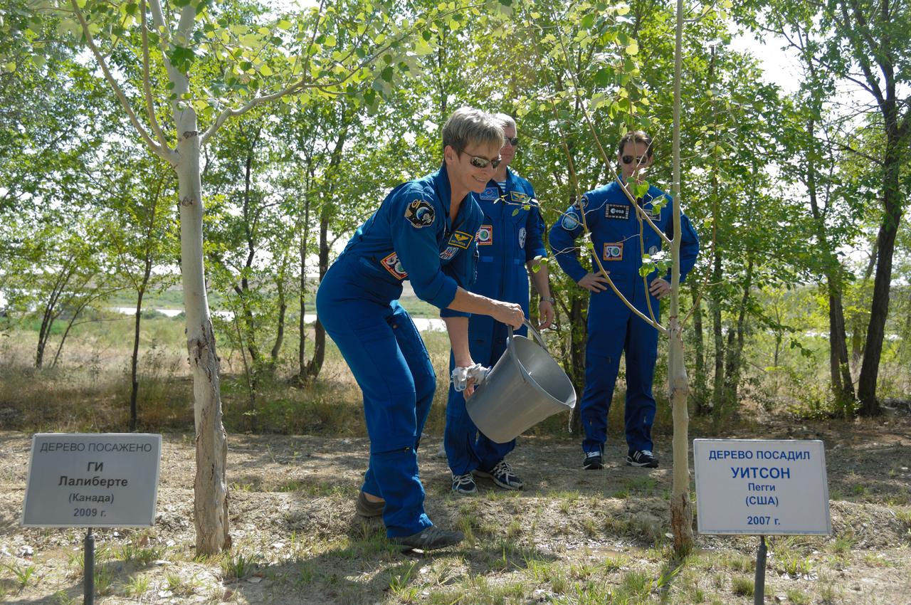 At the Cosmonaut Hotel in Baikonur, Kazakhstan, Expedition 48-49 backup crewmember Peggy Whitson of NASA waters a tree in her name first planted in 2007 during traditional pre-launch activities June 30. Whitson is one of three backups to the prime crewmembers, Kate Rubins of NASA, Anatoly Ivanishin of Roscosmos and Takuya Onishi of the Japan Aerospace Exploration Agency, who will launch July 7, Baikonur time, on the Soyuz MS-01 spacecraft for a planned four-month mission on the International Space Station. NASA/Alexander Vysotsky
